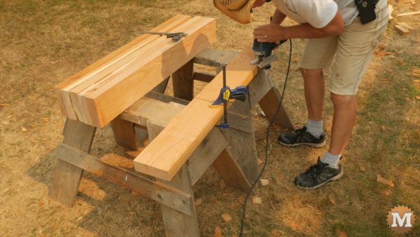 Rafters cut on sawhorses with jigsaw - Post and Beam Gazebo
