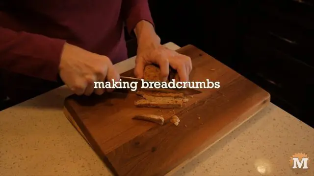 Making breadcrumbs from toast. Chopping on a cutting board