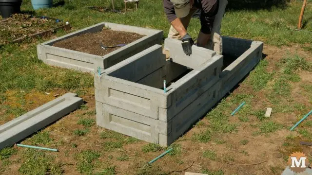 assembling the panels to make a garden bed