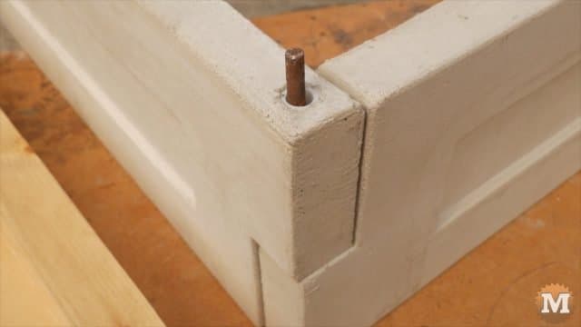 Pinned at the corners with metal bar