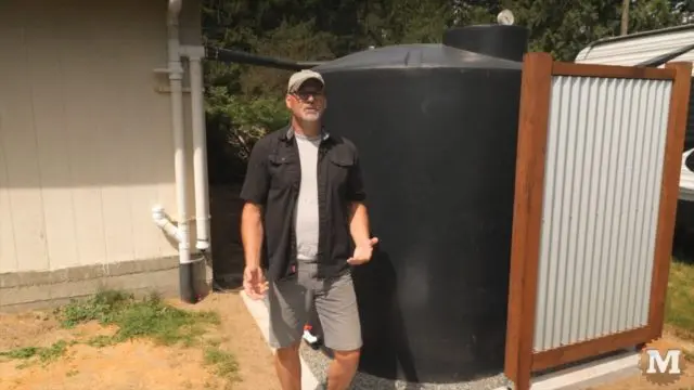 This 1200 gallon rainwater collection tank sits off the corner of my storage shed