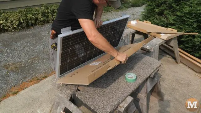 taping cardboard to protect and shield the solar panel