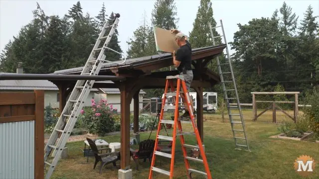 setting the solar panel on the pavilion roof