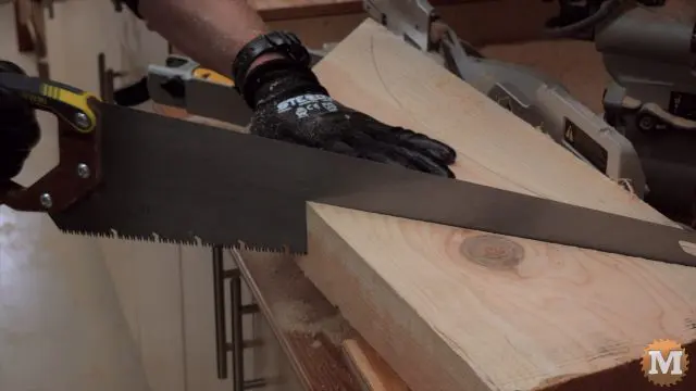 handsaw finishes the cut