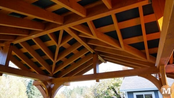 Flat black painted plywood over stained strapping Flat black painted plywood over stained strapping