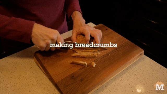 Making breadcrumbs from toast. Chopping on a cutting board