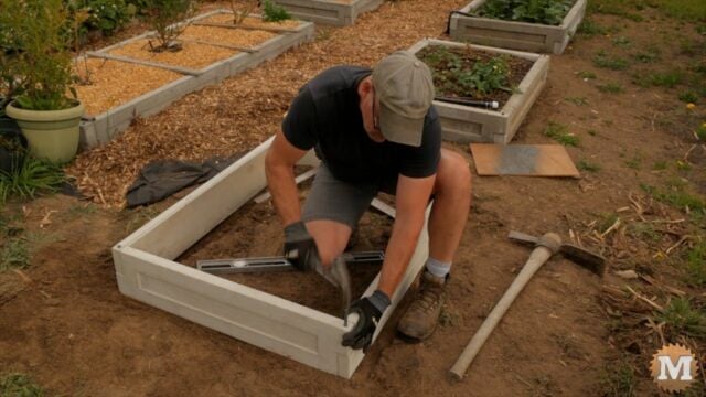 Tapping in pins to assemble garden box