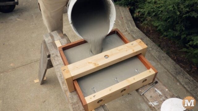 pouring the concrete into a form