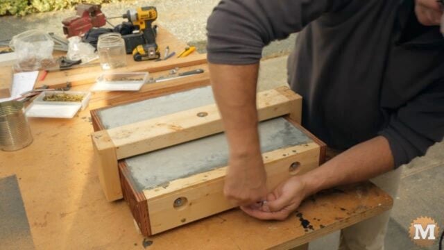 stripping the forms from the concrete casting