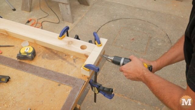 a DIY drill guide to help drilling into the end of the spreader