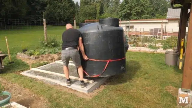 Setting 500 gallon rainwater tank in place