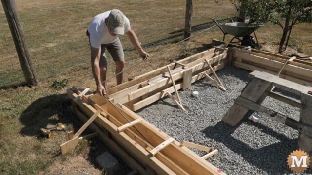 Laying rebar into concrete foundation forms