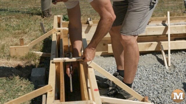 Tying rebar together in the concrete foundation forms