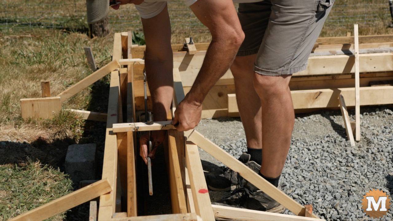 Tying rebar together in the concrete foundation forms