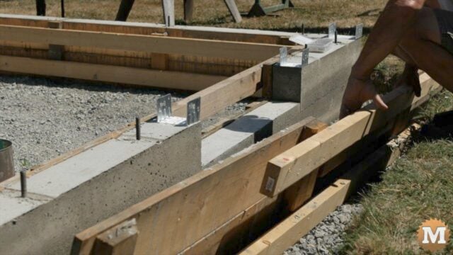 Stripping forms from a concrete foundation