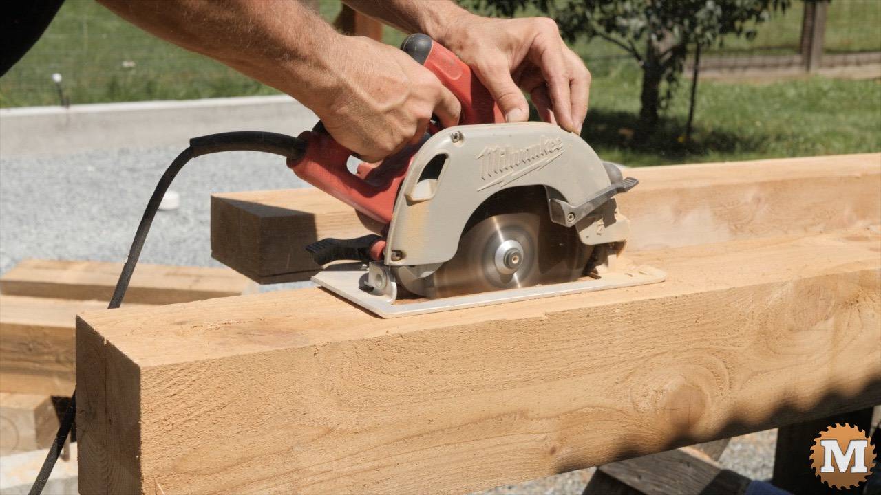 A circular saw ripping into a cedar 6x6 beam