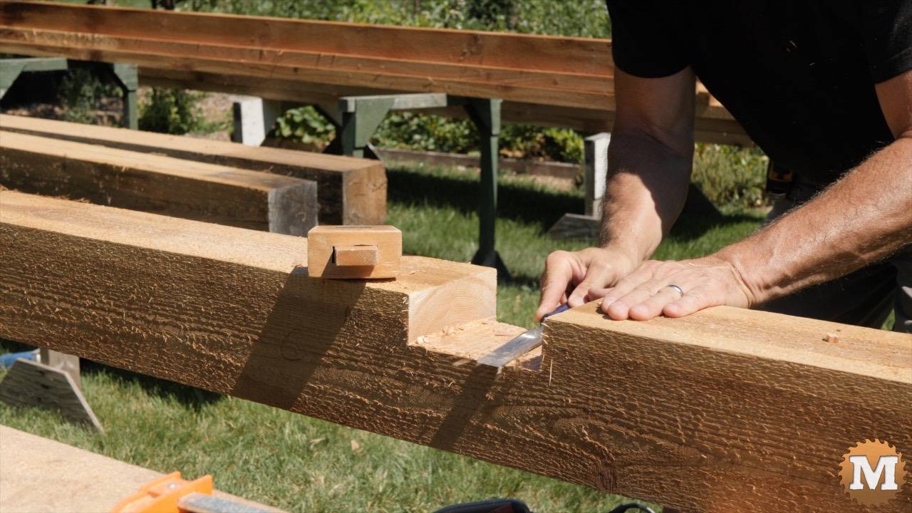 Cleaning up dado in 6x6 cedar beam with chisel