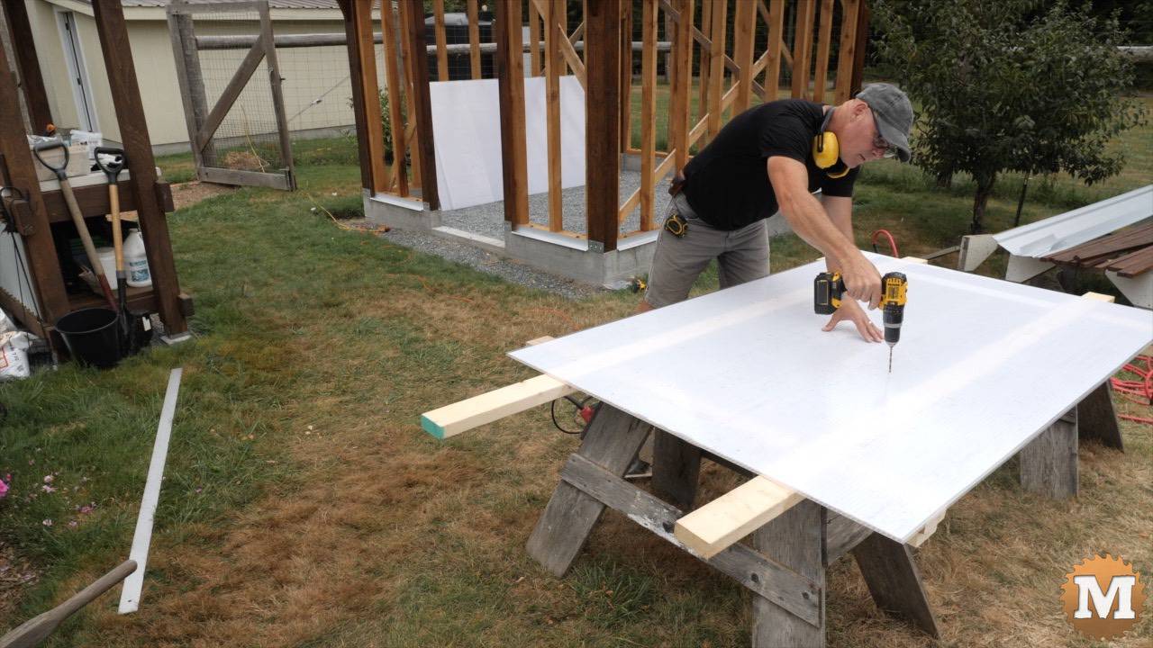 Drilling pilot holes for screws in the greenhouse glazing panel