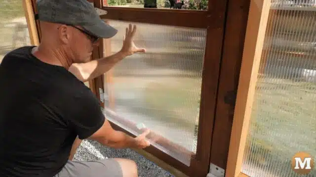 Installing polycarbonate glazing in the door of a greenhouse