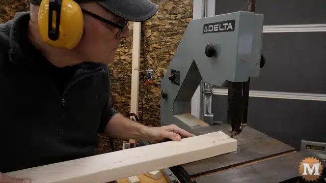 Cutting the 2x4 front edge of the lower shelf on the bandsaw