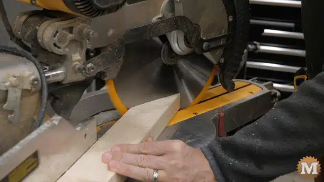 Cutting the upper shelf braces on the miter saw