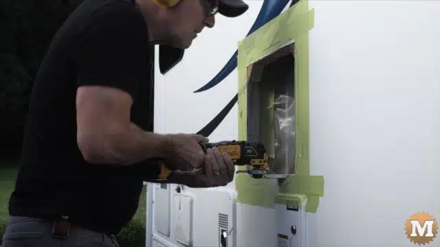 Cutting the camper wall with an oscillating saw
