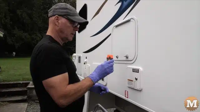 A plastic razor blade scraper works very well and doesn't scratch the camper when removing excess butyl tape or silicone