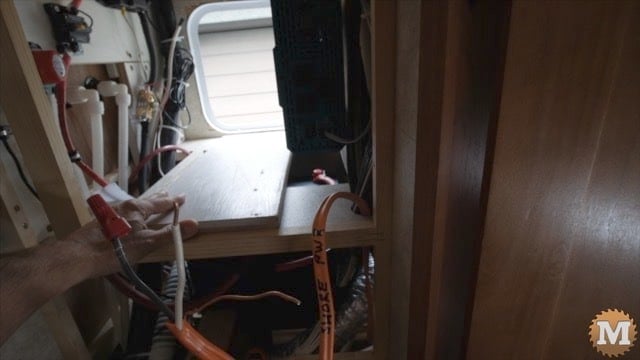 Added a plywood piece for the transfer switch over the batteries