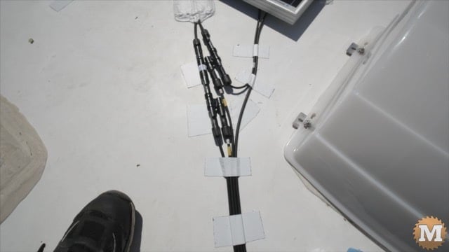 Cables with Y connecters taped to the roof of the RV
