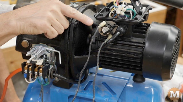 Dryer thermostat attached to pump motor housing with high temperature zip tie and silicone