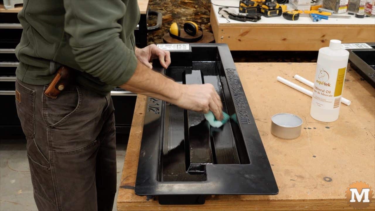 applying mineral oil to the inside cavity of a concrete mold