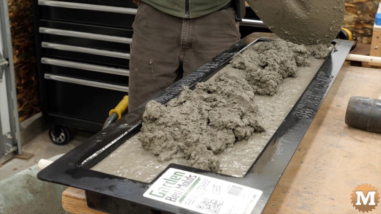 a few more shovels of wet concrete mix