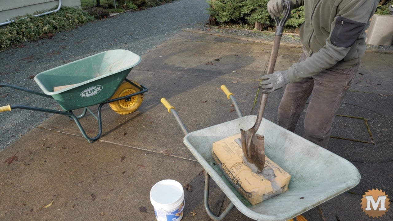 breaking the paper bag with the edge of the shovel