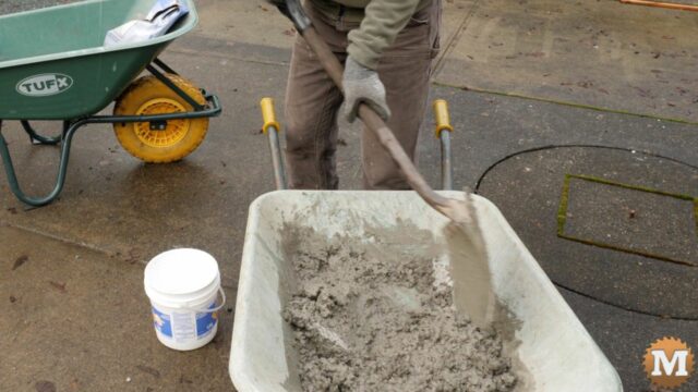 mixing concrete in a wheelbarrow