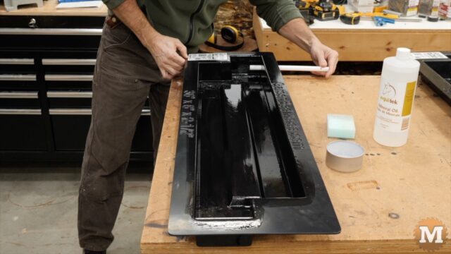 oiled pipes are slid into holes in the mold with the small hole end set outside of the flange edge