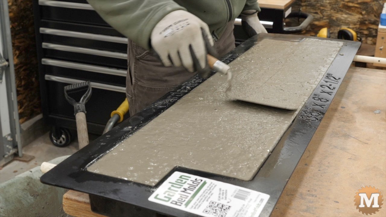 a small trowel is used to smoth the surface of the concrete