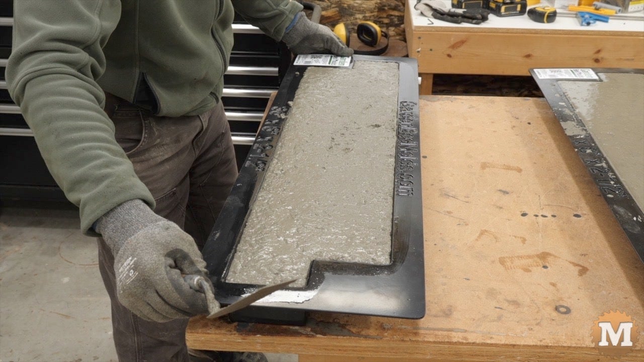 the mold is gently shaken back and forth to settle the mix into the corners