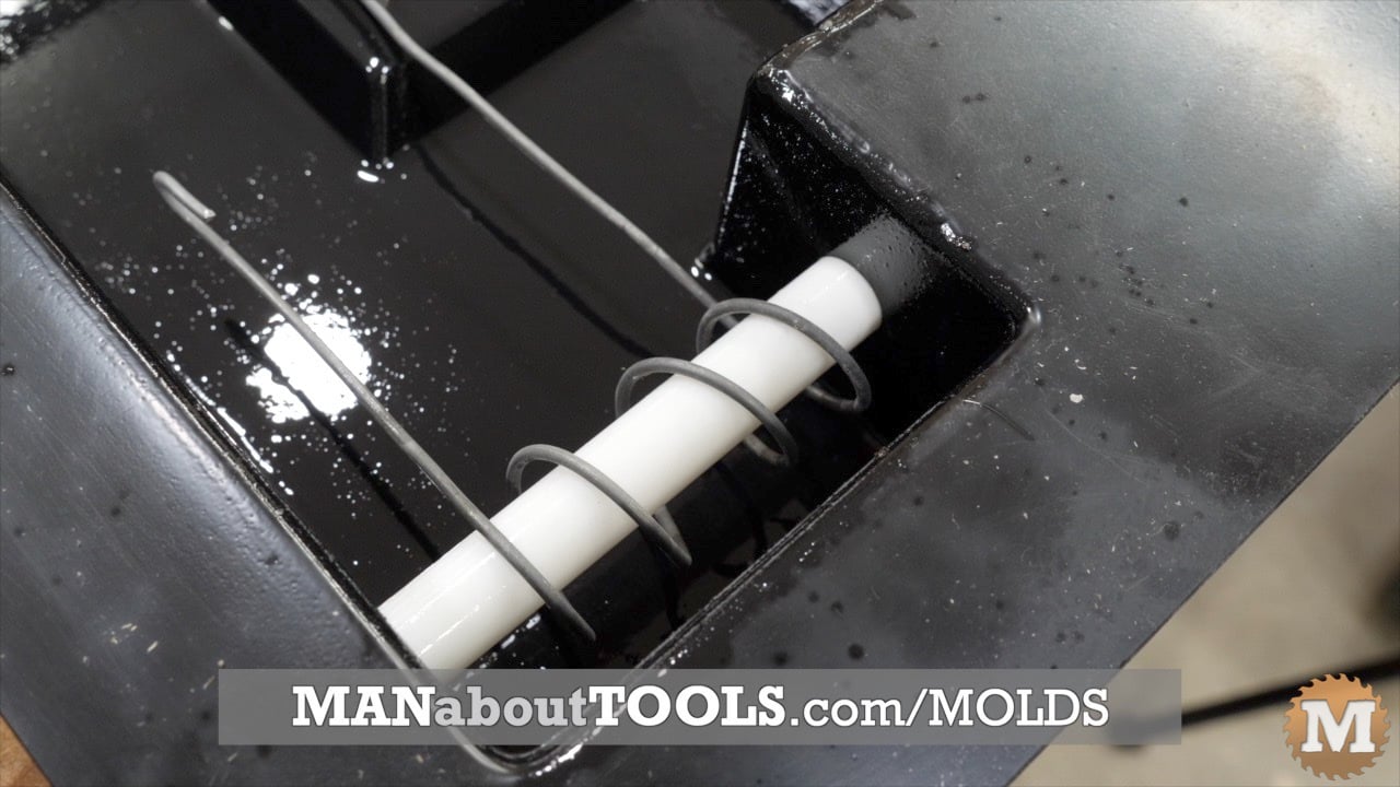 close up of the galvanized fench wire wrapped in a spiral around the hole forming pipes