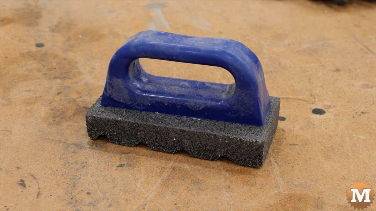 concrete rub brick with plastic handle