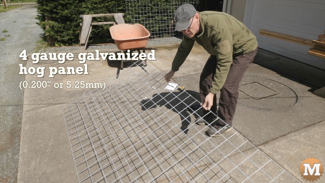 A man laying out a wire grid