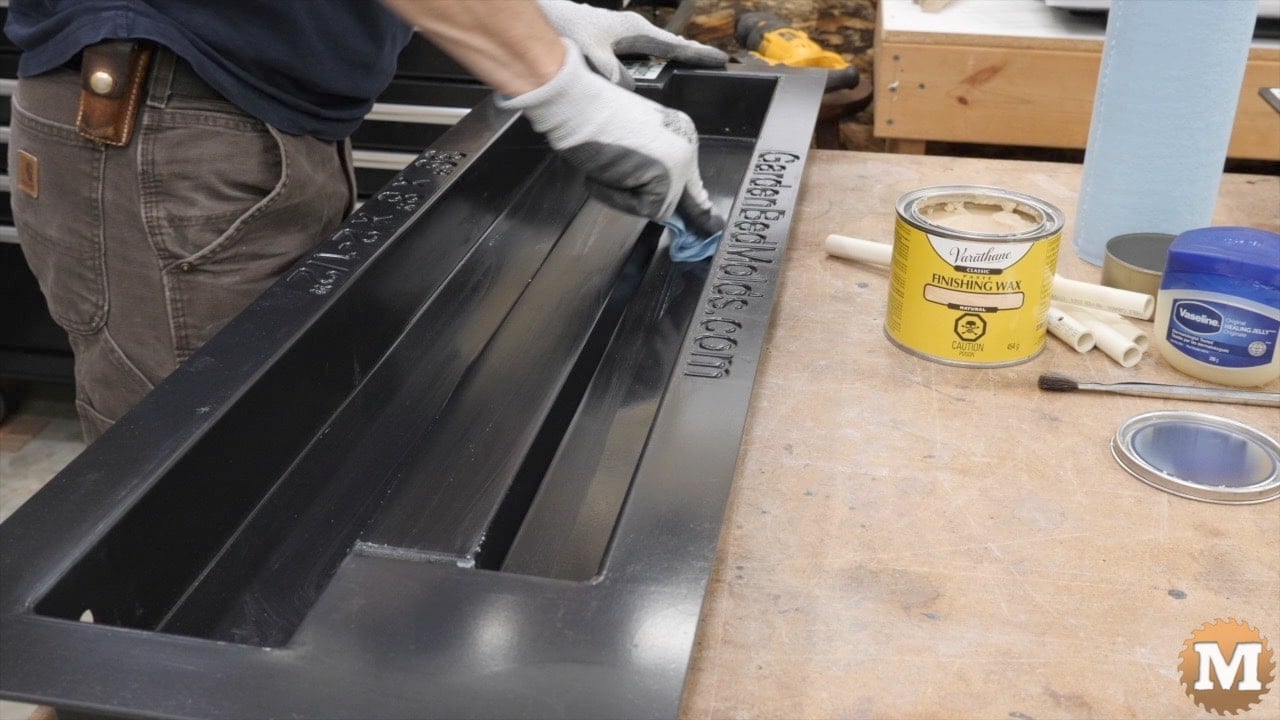 applying wax to a plastic concrete mold