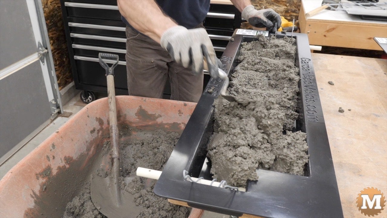 Spreading the wet concrete with a small trowel