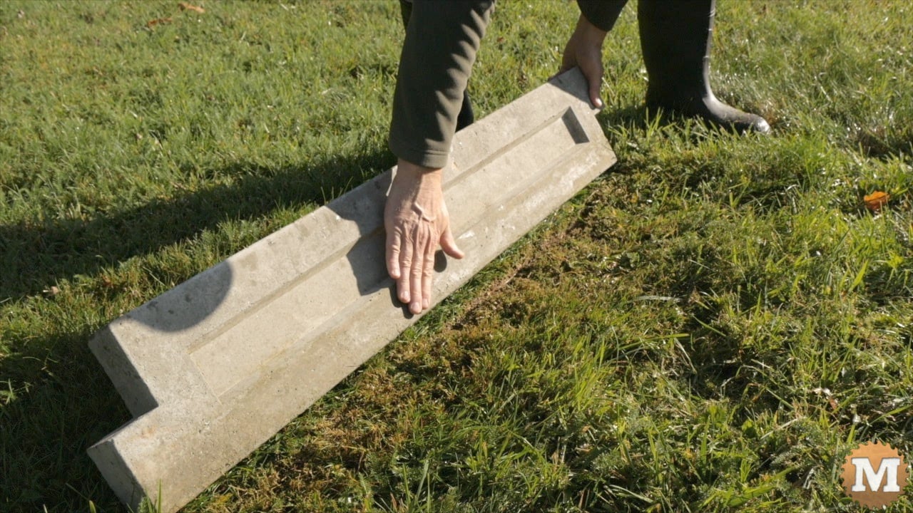 hand touching concrete panel