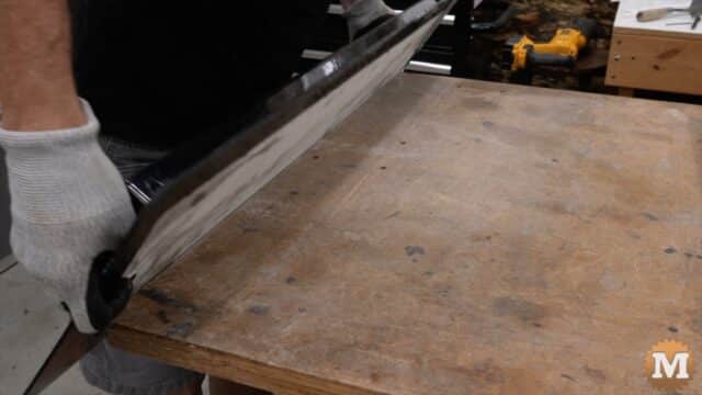 A man putting a concrete mold upside down