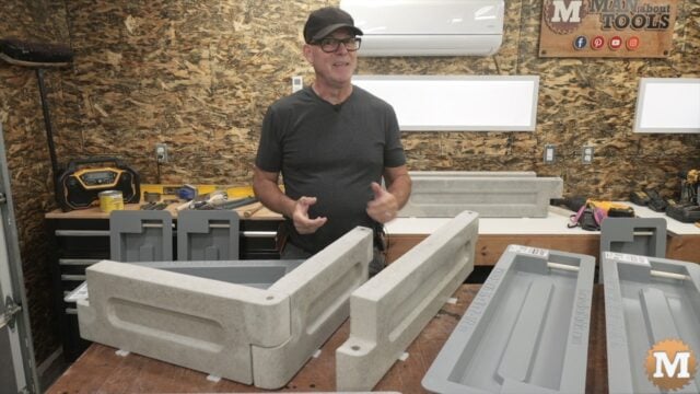 man with concrete castings on a bench