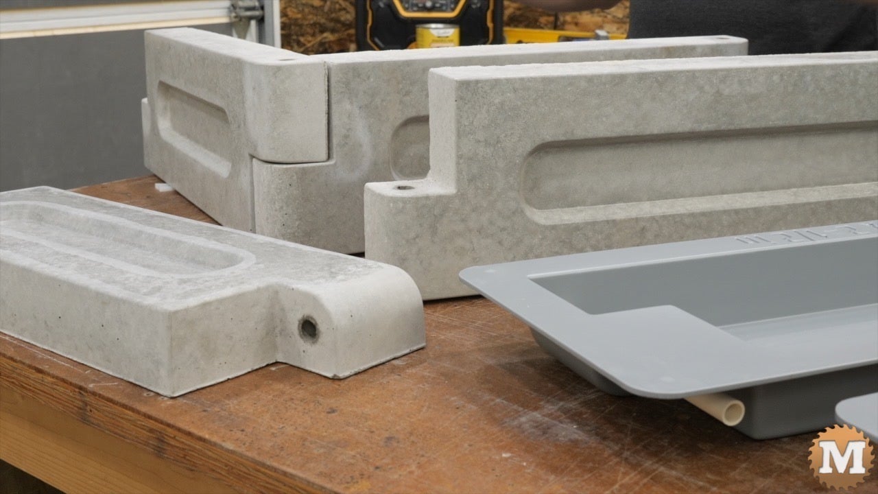concrete castings and molds on a bench