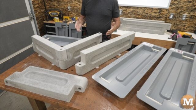 overhead view on concrete castings and molds on a workbench