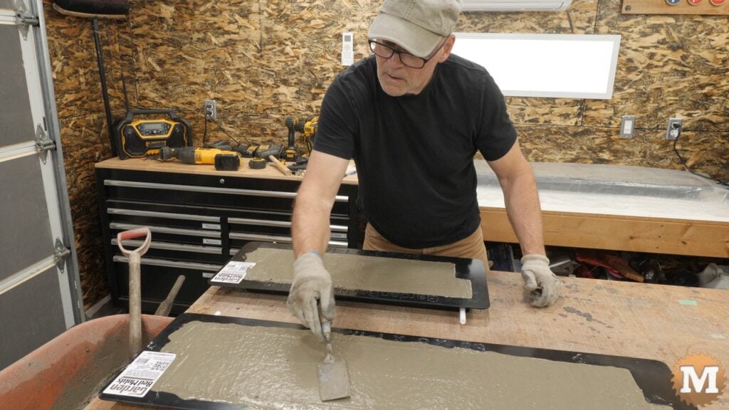 a man troweling freshly poured concrete