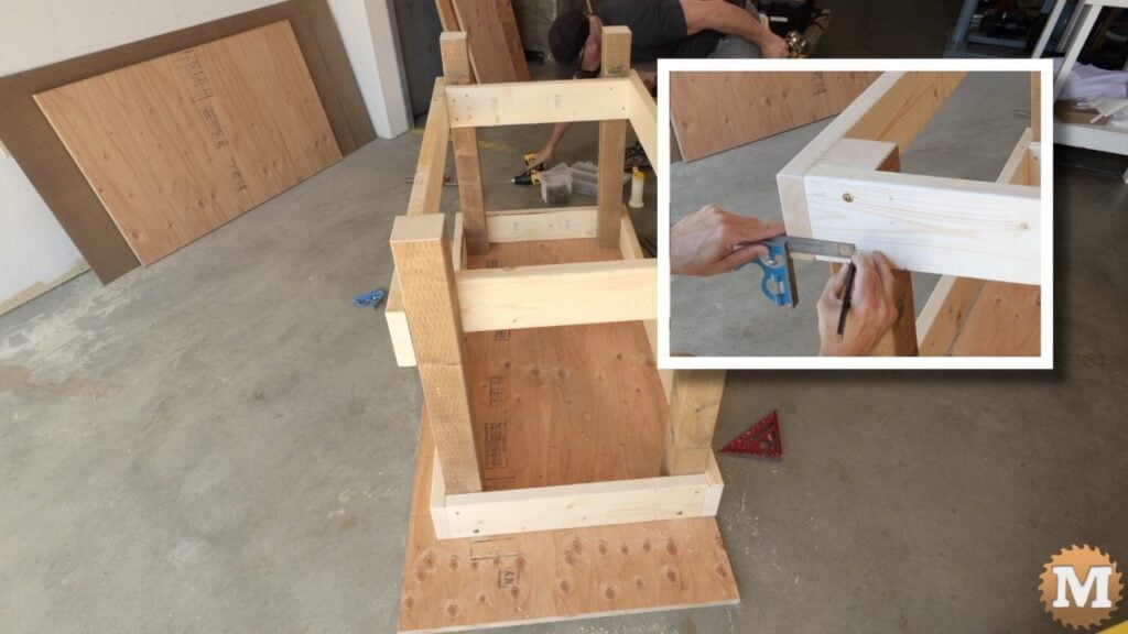 a man building a wooden workbench