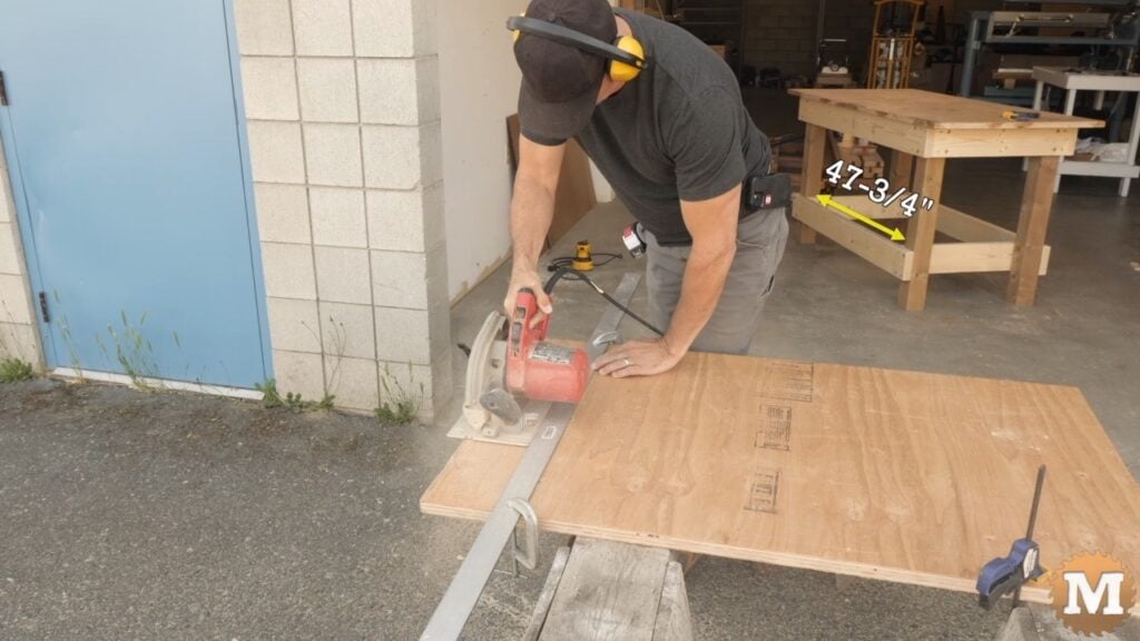 a man cuts plywood with a circular saw and straight edge